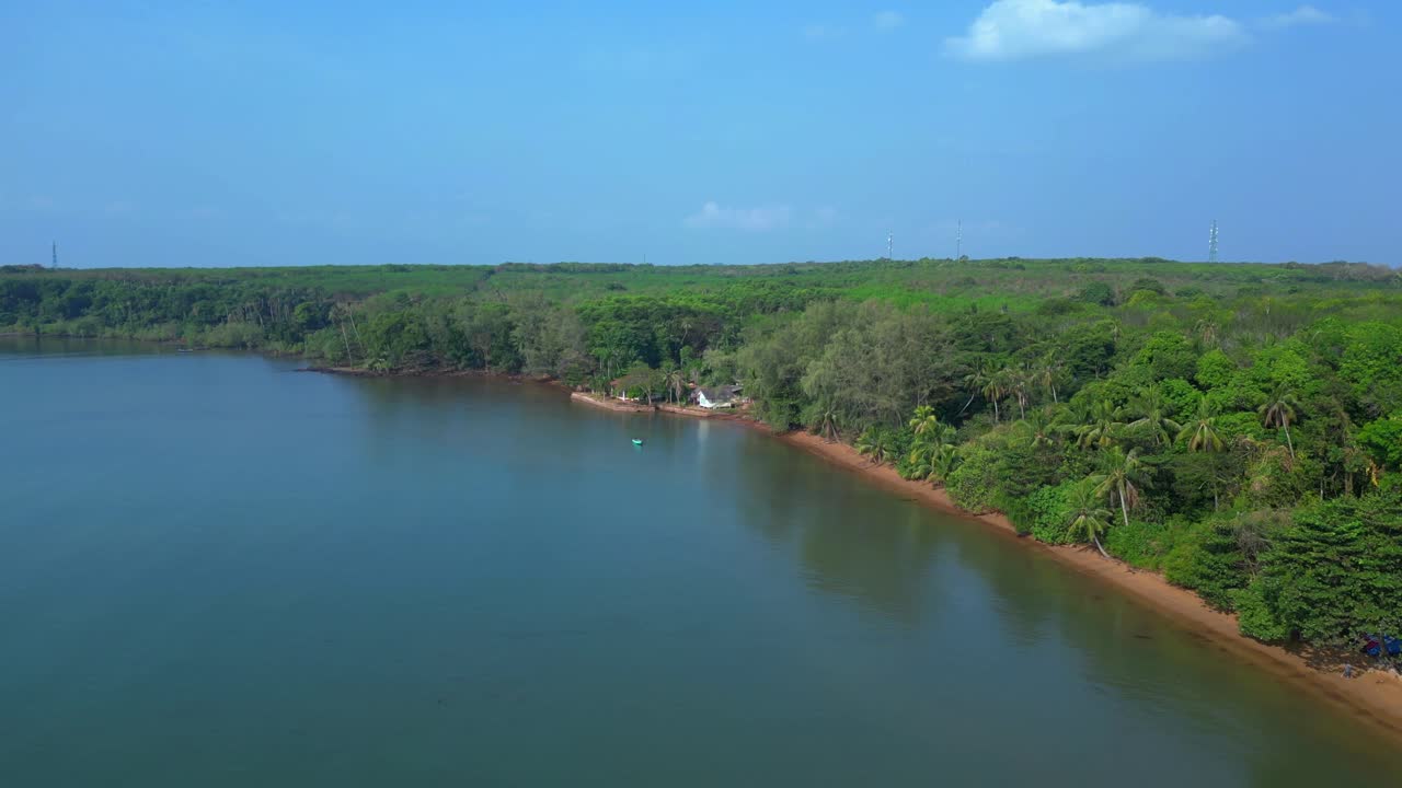 Small fishing boat floating near tropical coast of Koh Mak island, Thailand. Unbelievable aerial view flight wide orbit overview drone