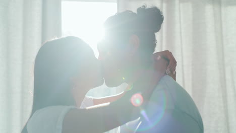 Happy,-couple-kiss-and-love-in-home-lens-flare