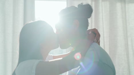 happy, couple kiss and love in home lens flare