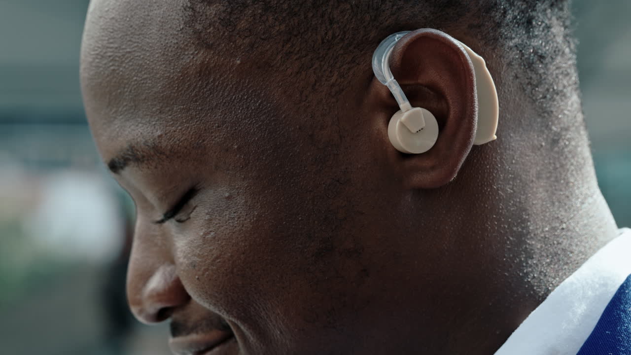 Close-up of a person's ear with a hearing aid