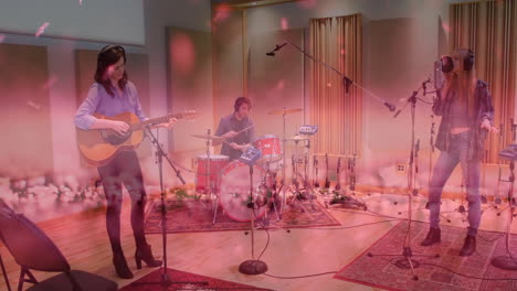 bandmates playing guitar drumming singing in recording studio, showing floating waveform graphs