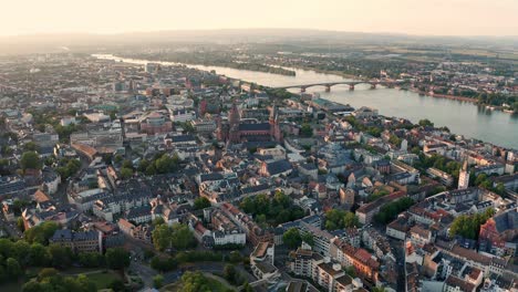 sunny weather drone approaching the dom of mainz with rhine river bridge in the background