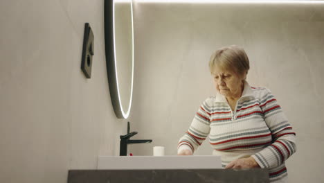 elderly woman in modern bathroom