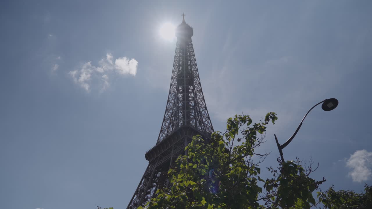 Eiffel Tower with Sun Blazing Behind on a Clear Day