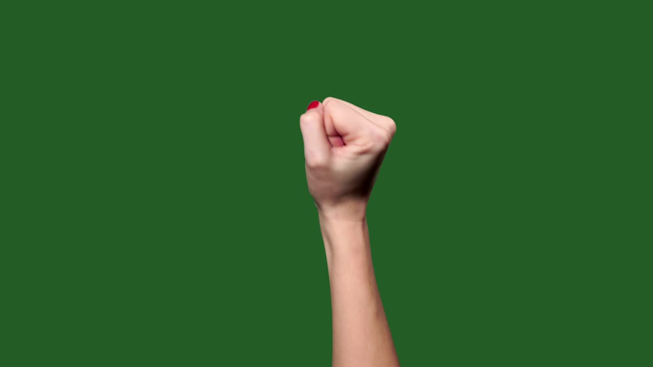 Chromakey. Green screen. Female fist knocking at the door.