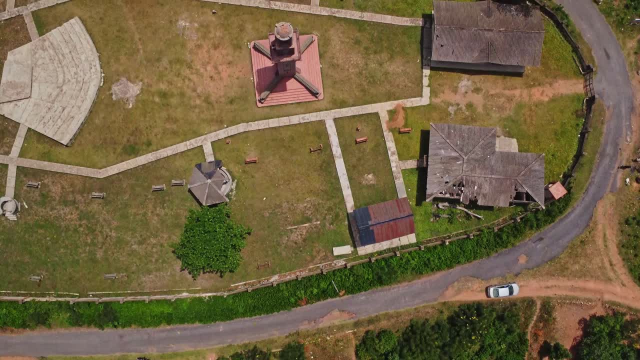 Top down aerial of Bowers Tower and several other buildings on top of the Oke Are hill in Ibadan, Nigeria