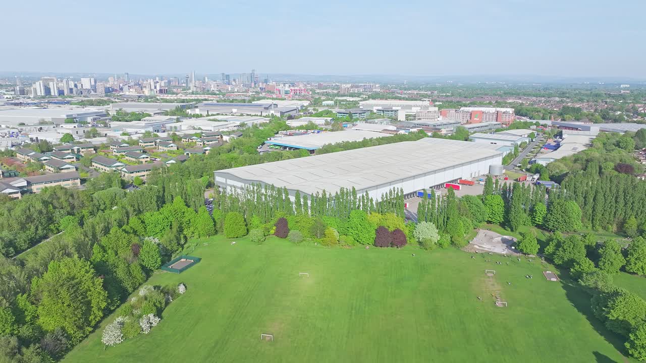 Aerial View Of Lostock Park With Manchester Skyline In The Distance, Urban Cityscape