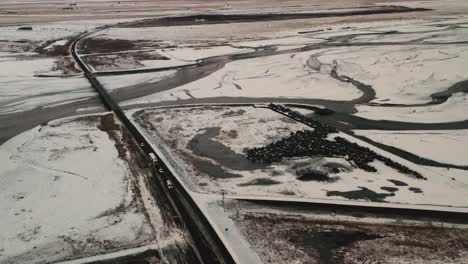 Driving-cars-and-truck-in-rural-road-in-winter-snow