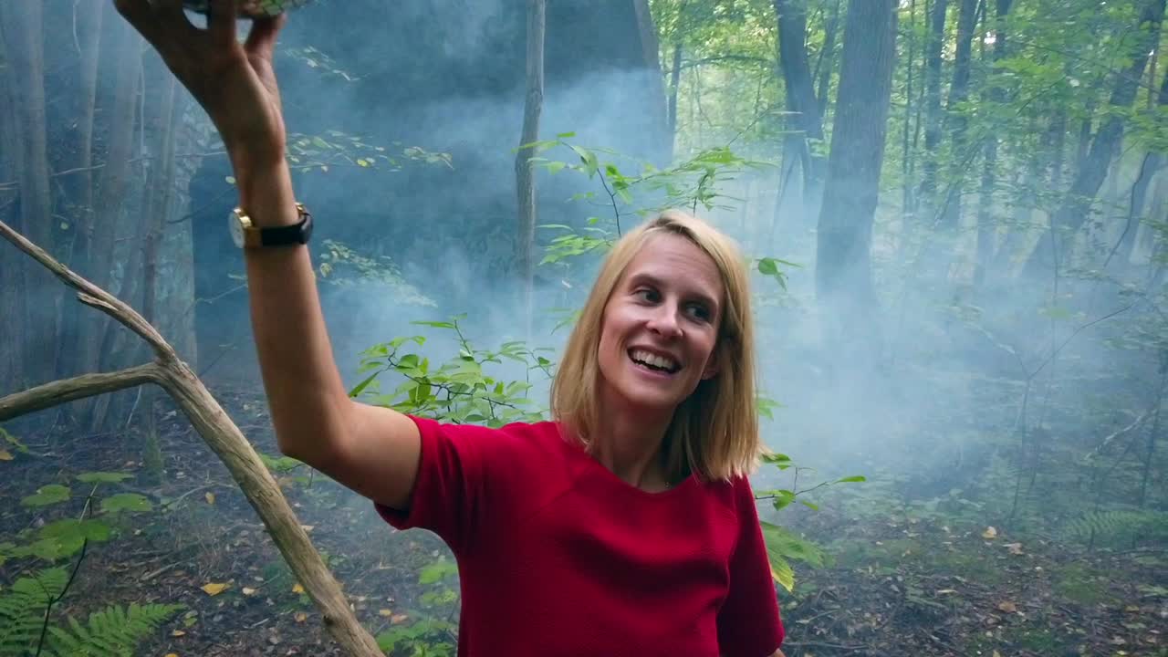 Buttery soft slow motion cinematic shot of a young blond girl having fun with a mirror ball in one hand on a russian shooting range Foto video shoot on lost places nature 1080, 24p by Philipp Marnitz