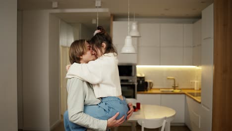 romantic evening - woman jumps to his boyfriend hands and whirling in dance