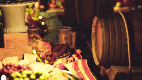 a diverse array of food and drinks displayed on a rustic dining table at dusk