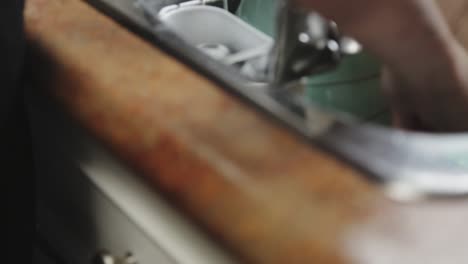 cutlery being cleaned and left to dry