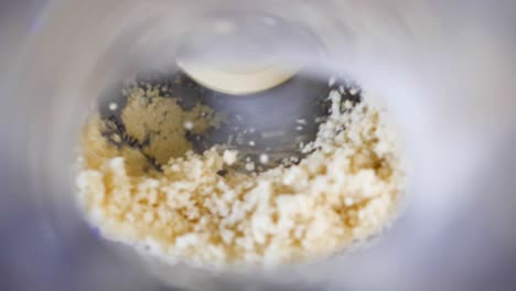 close-up-dough-being-processed-in-food-processor