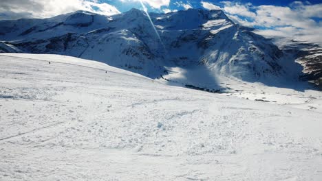 pov person skiing down a slope in the alps