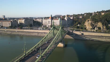 aerial pullback reveals freedom bridge  in budapest, hungary