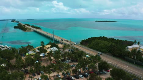 aerial 4k uhd drone footage of the famous highway one leading from miami beach all the way down to key west in florida. the turquoise atlantic ocean water is surrounding the coral reef islands