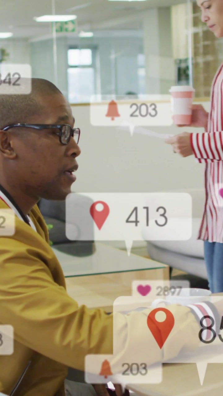 Vertical video: Businessman checking tab for alerts as icons crowd near hands, move right past peer