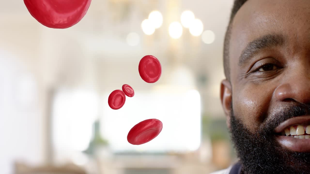 Man speaking, causing animated red blood cells to rotate and pass in front, showing health concept