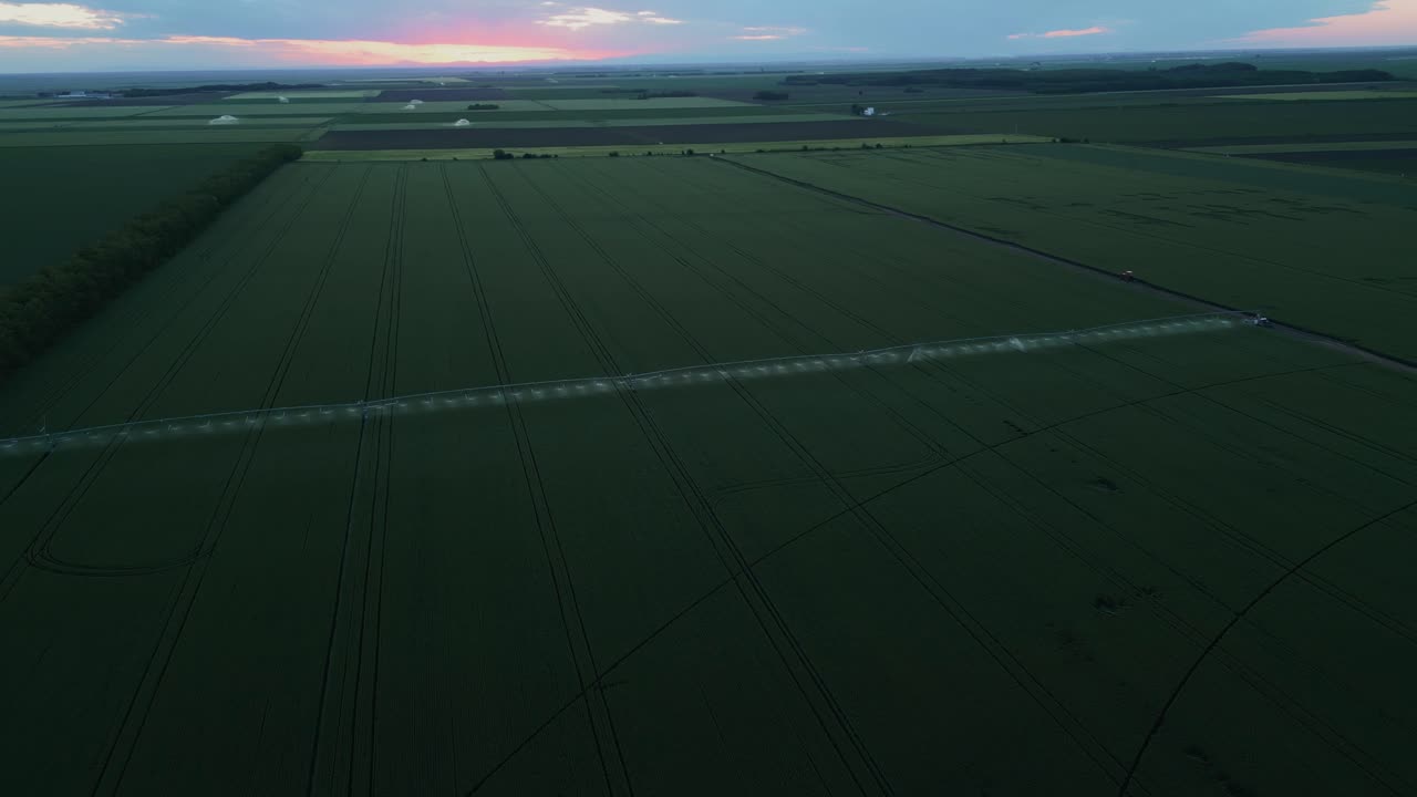 Sweeping Views Of Agricultural Crops At Sunset. Aerial Drone Shot