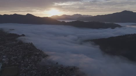 Aerial-view-of-a-Beautiful-sunrise-of-Zacatlán-whit-fog