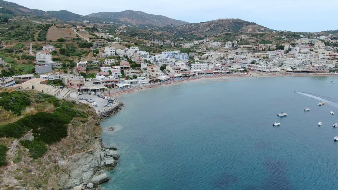 Paradise beach in Crete Island, touristic Mediterranean destination. Aerial forward