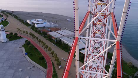 first-person view from the cab on the ferris wheel near the sea. pov