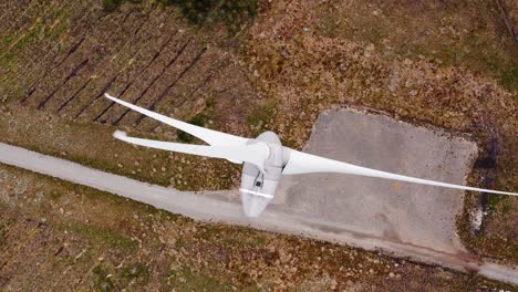 aerial shot above a wind farm in operation on a moorland in scotland