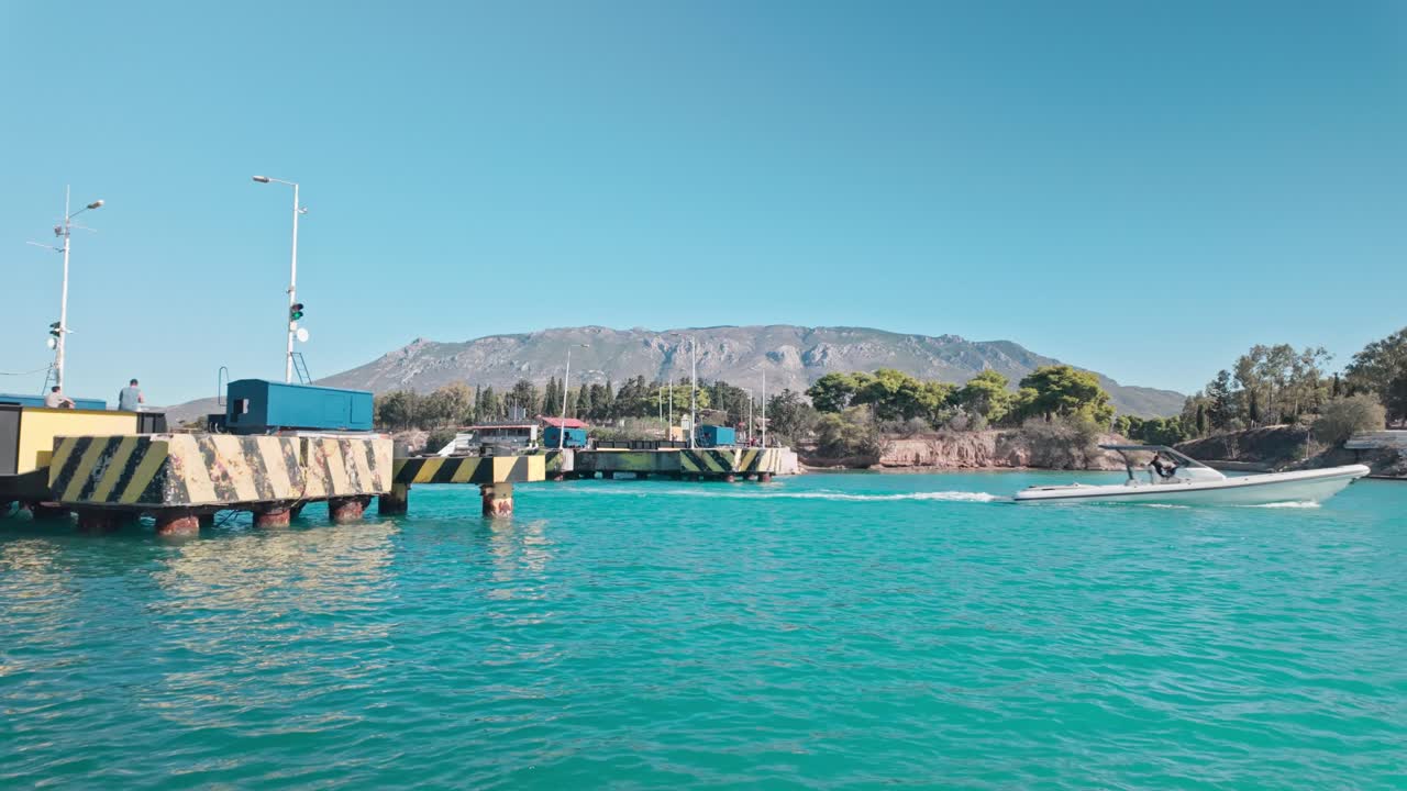 Leisure boat crossing Corinth canal submersible road bridge