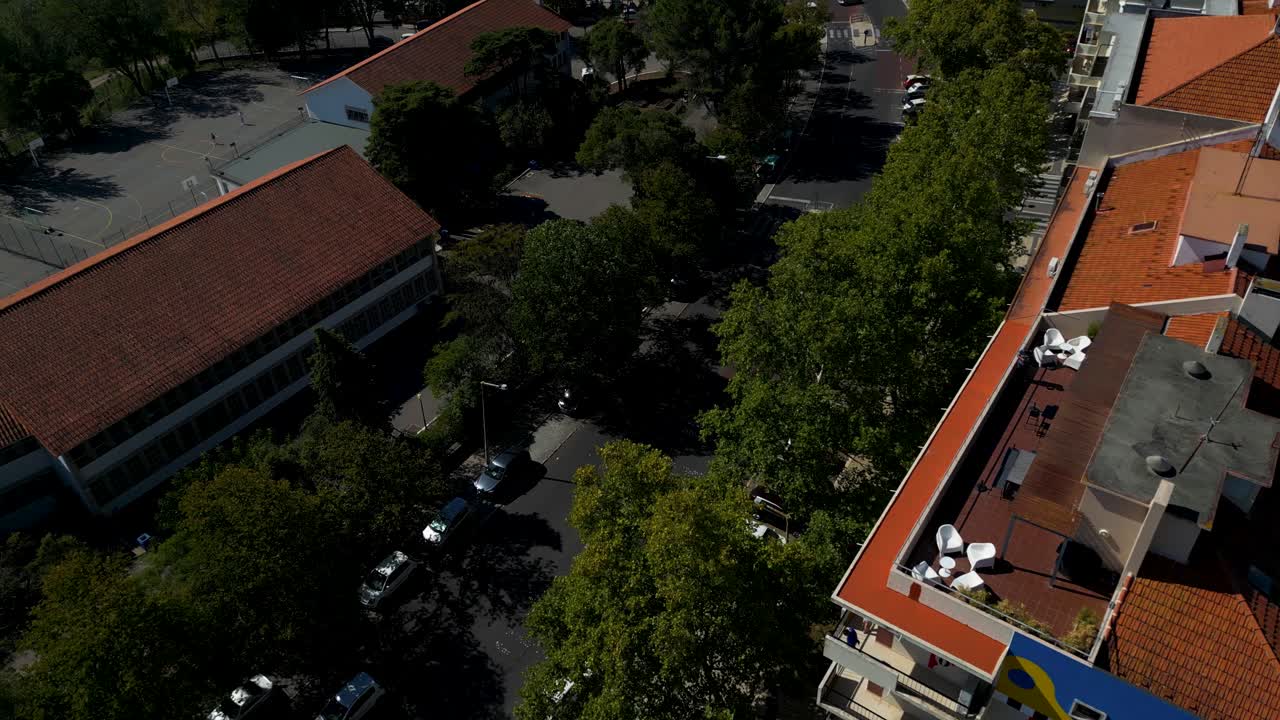 Revealing aerial of city dwelling in Lisbon, unveils the city's dynamic urban landscape, with a captivating focus on city dwellings along the scenic river Tagus