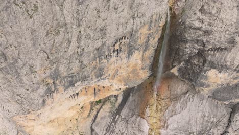 Cinematic-aerial-tilt-up-view-of-Murfreit-waterfaall-near-Passo-Gardena