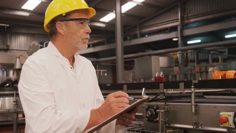 engineer maintaining record in clipboard