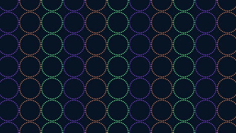 patrón simétrico repetitivo de círculos de colores sobre un fondo oscuro