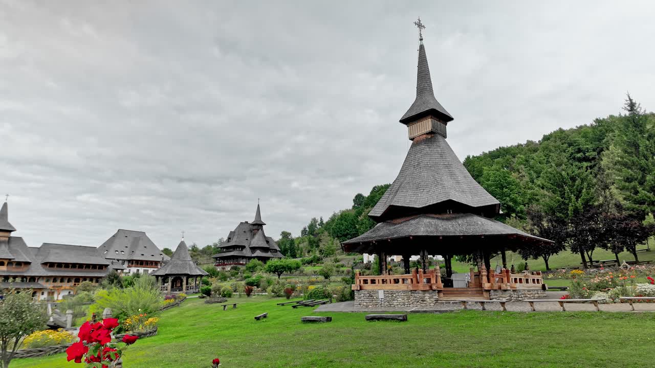 Summer chapel amid landscape gardens at Barsana monastery Maramures