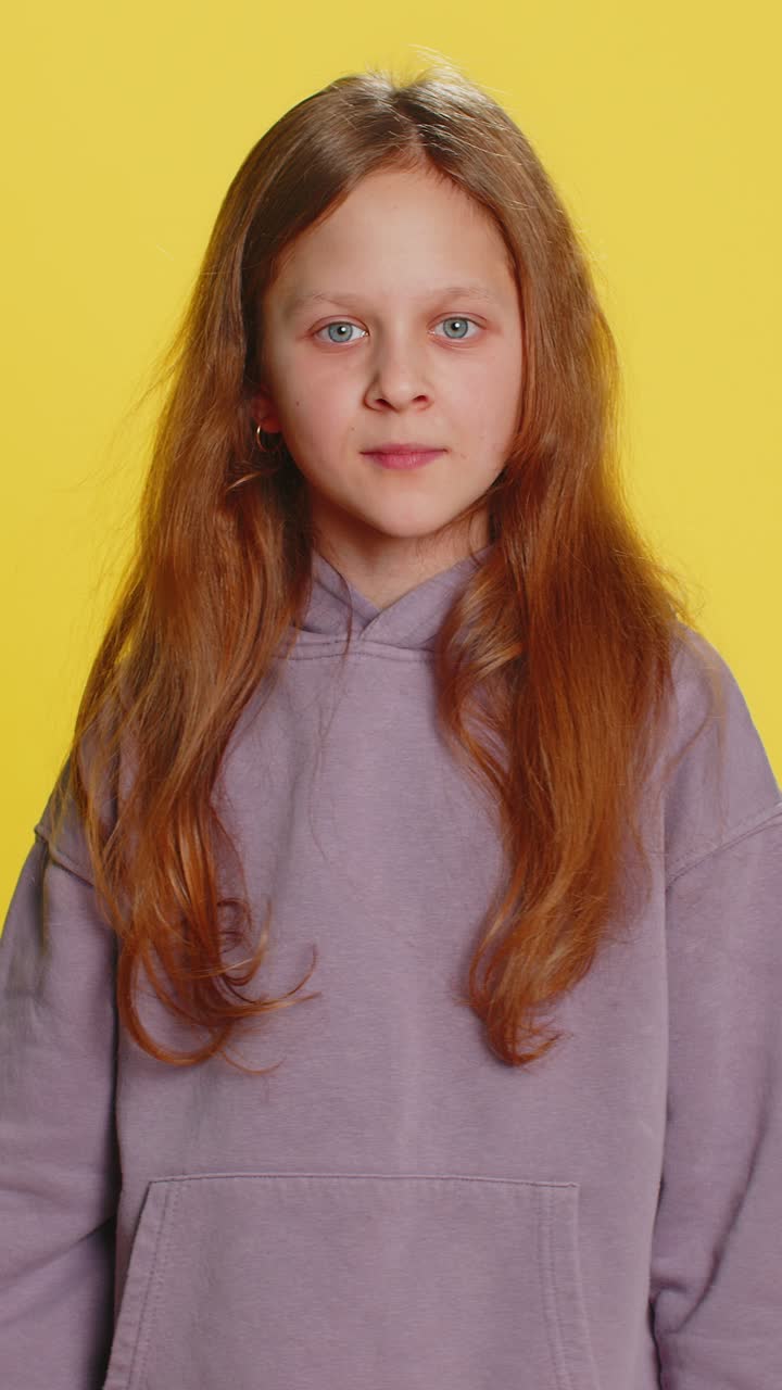 Aggressive angry child girl trying to fight at camera shaking fist boxing punishment threaten