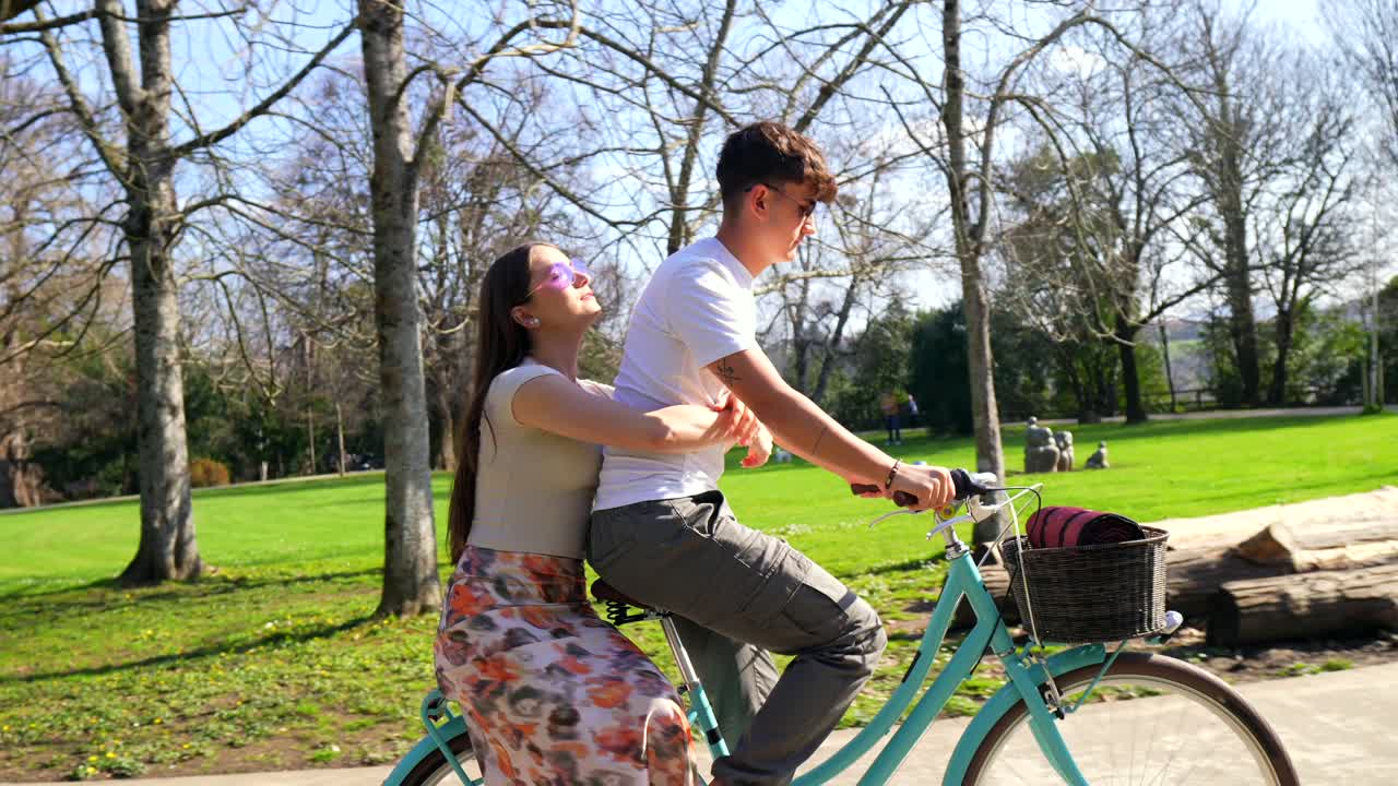 Couple enjoying a bike ride in the park