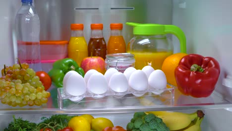 Open-refrigerator-filled-with-food