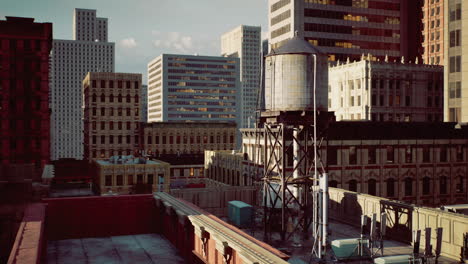 urban landscape features water tower amidst skyscrapers in city center