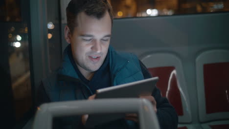 Passenger in the bus working with touch pad