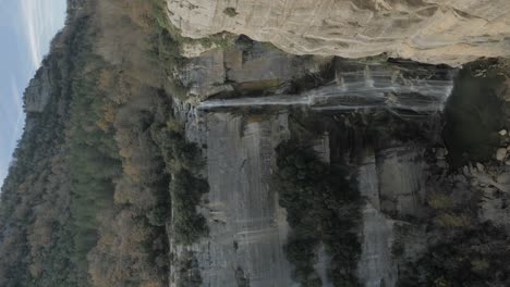 Huge-waterfall-at-a-rock-hill-in-Spain-vertical