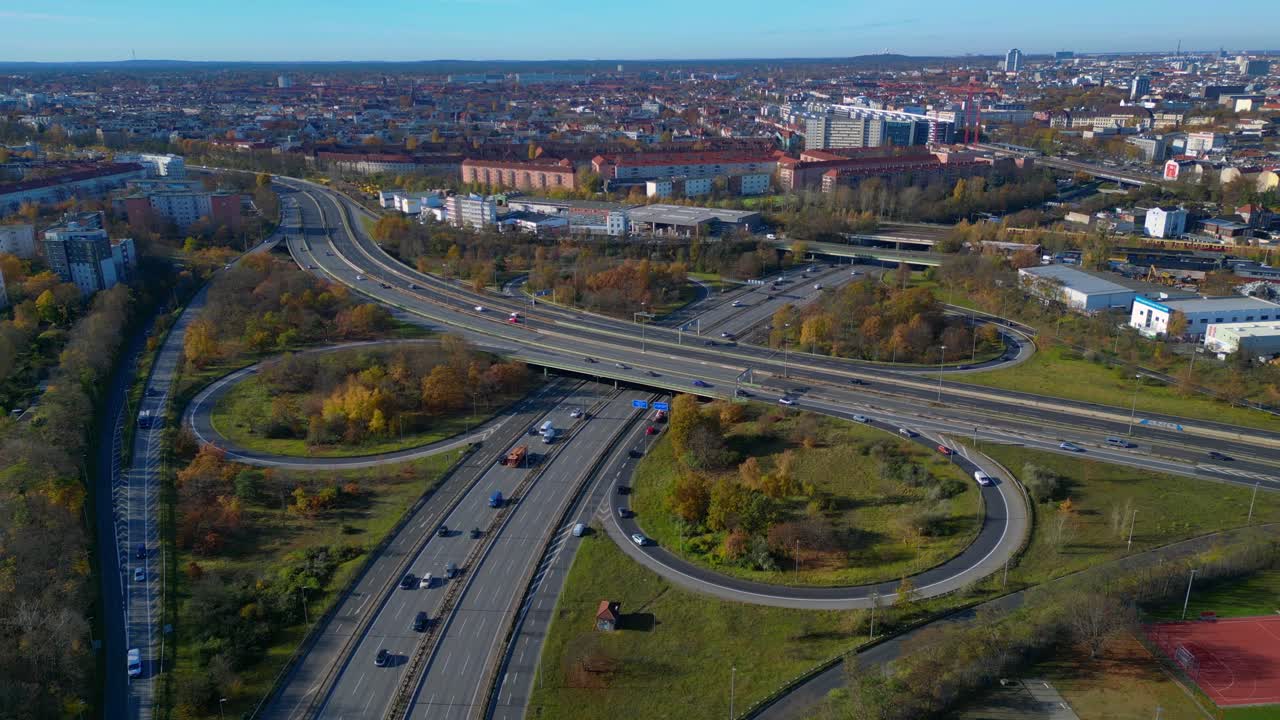 Aerial view tracking over the vast urban landscape of Berlin under a clear sky. Great aerial view flight panorama overview drone