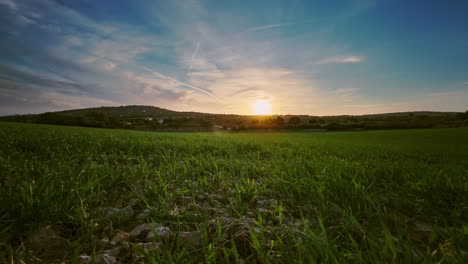 Stunning-timelapse-Boomerang-video-of-a-green-meadow,-gentle-hill,-and-floating-clouds-in-a-blue-sky