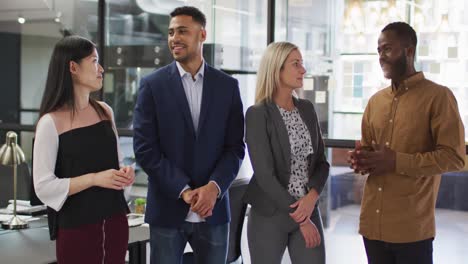 Portrait-of-group-of-diverse-businesspeople-with-arms-crossed-smiling-looking-at-camera