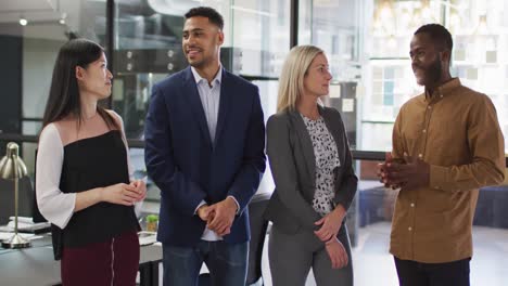 portrait of group of diverse businesspeople with arms crossed smiling looking at camera