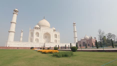 majestic white marble taj mahal overlooking mughals gardens - slow pan