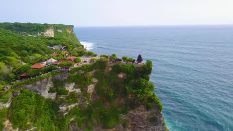 aerial over the beautiful hindu temple tanah lot perched on a cliff in bali indonesia