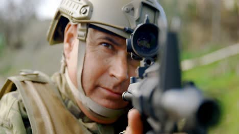 front view of mid-adult caucasian military soldier rifle training in fields during training 4k