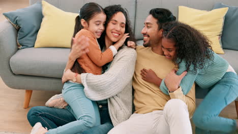 Happy-family,-parents-and-children-hug-at-home