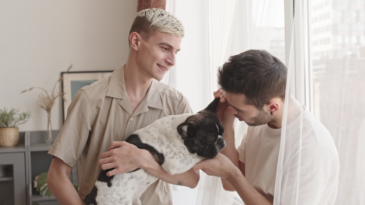 Two Gay Men Petting Cute Dog at Home
