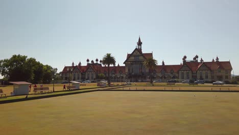 Reveal-of-Rotorua-Museum-in-New-Zealand,-Pan-Right,-Slow-Motion