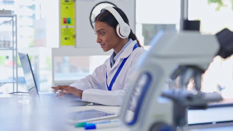 science, laptop and woman with headphones